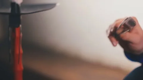 Man blows on coals Stock Footage 76956335