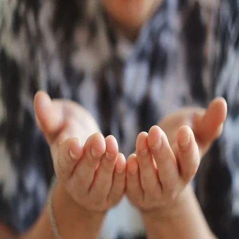 A man blows off his hands with beautiful colored particles Stock Footage 69541646