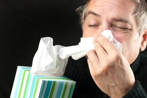 Man blows nose Stock Photos