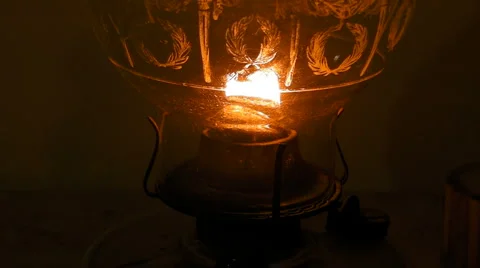 Man blows out flame - antique oil lamp v2 close-up Stock Footage 6530390