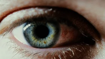 Man blue eye iris blinking, extreme close-up, macro 4k Stockbeeldmateriaal 85953476