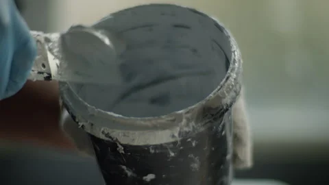 A man in blue gloves is preparing to paint Video stock 271559612