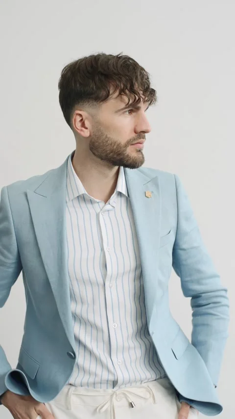 Man in blue jacket and white shirt on white background Stock Footage 277568454