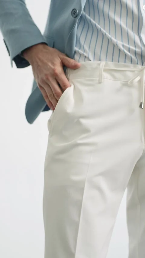 Man in blue jacket puts his hand in his pants pocket Video stock 274162875
