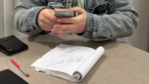 Man in blue jeans denim jacket at table counts cash money Video stock 306270351