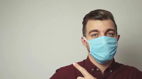 Man in blue protective medical face mask. Free space for text. Stock Footage