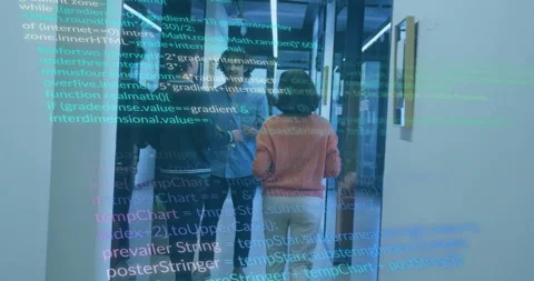 Man in blue shirt gesturing and activating code overlay for tech team while Stock Footage 312005108