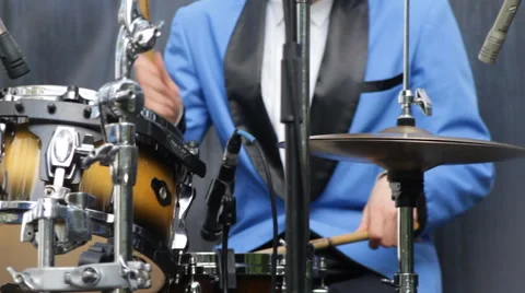 Man in blue suit playing drums - closeup 動画素材 68596406