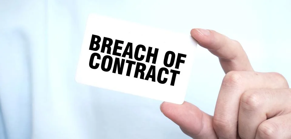 Man in blue sweatshirt holding a card with text BREACH OF CONTRACT, busines.. Stock Photos
