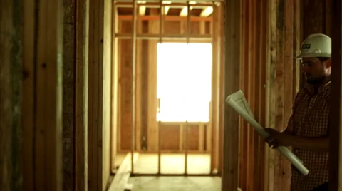 Man with Blueprints on Construction Site Stock Footage 34403639