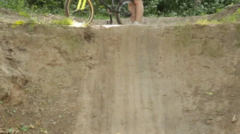Man on bmx in the woods the sun Stock Footage 65308184