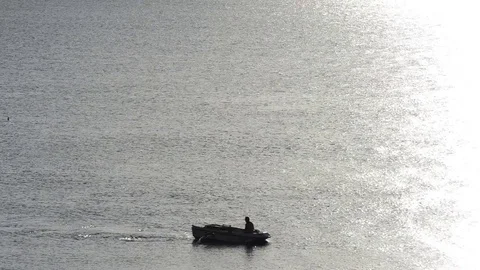 Man on the boat back rowing Stock Footage 82964599
