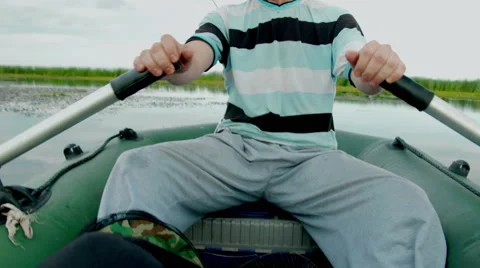 Man on boat. Close up view to the rubber boat paddle. rowing oars. Stock Footage 65480943