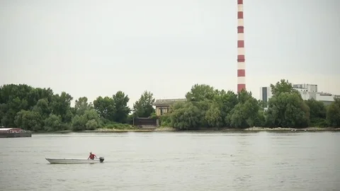 Man in a boat on a Danube river Stock Footage 77478902