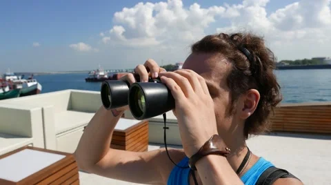 The man on the boat looking through binoculars 動画素材 64627873