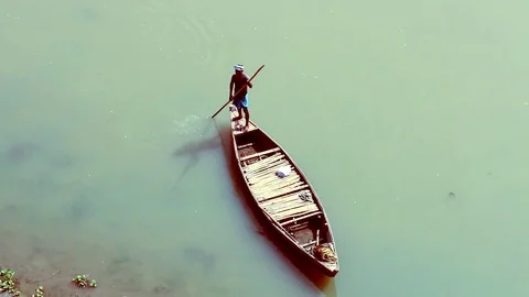 Man On The Boat With Oar Stock Footage 82966381