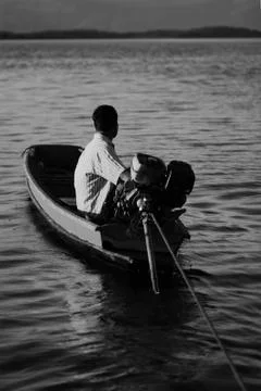 Man in a boat Stock Photos