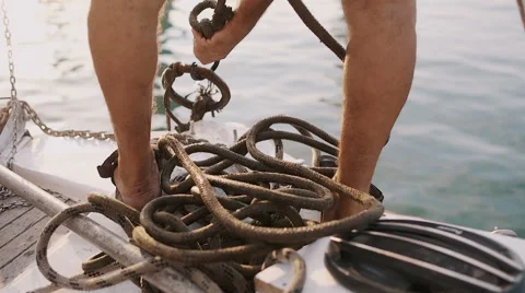 Man on the boat pulling a rope Stock Footage 67478993