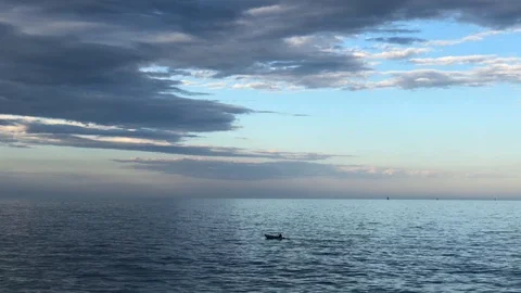 Man in boat rowing in the sea Stock Footage 107991465