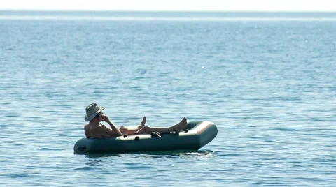 Man in a boat at sea Stock Footage 40540485