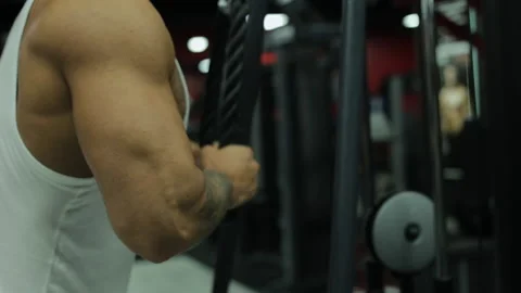 Man Bodybuilder Does Exercises For Triceps in Gym Stock Footage 136102014