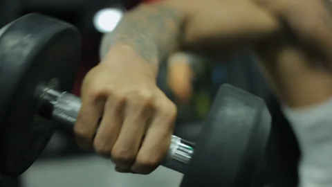 Man Bodybuilder Pumping Muscles Workout Stock Footage 136101793