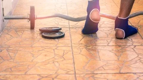 Man Bodybuilder wait exercises with barbell weights power handsome Stock Photos