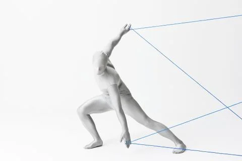 Man in bodysuit playing with string Foto stock