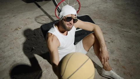 Man bonding while playing basketball outdoors in slow motion Stock Footage 302825378