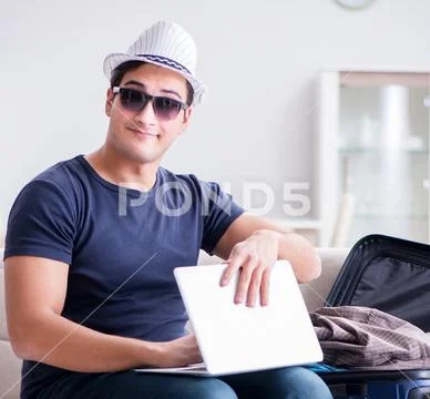 Man booking online his travel flight and hotel Stock Photos