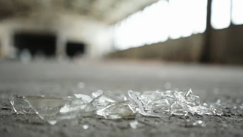 Man in boots walking away from broken glass Stock Footage 88052338