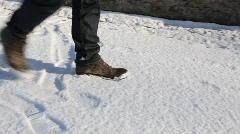 Man in Boots Walks Past Camera in Winter Snow - HD 1080 Stock Footage 60745256