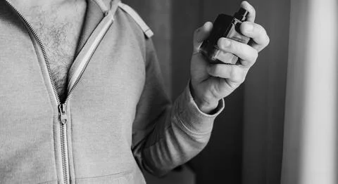 Man with a bottle of perfume Foto stock