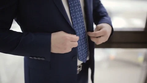 A man bottons suit 스톡 동영상 74934564