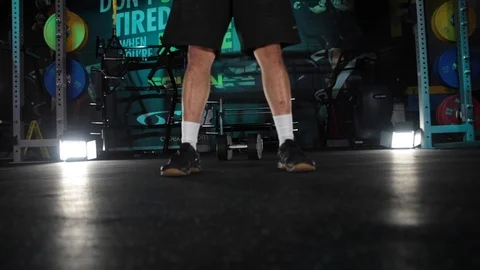 Man bouncing ball in the gym Stock Footage 104925872