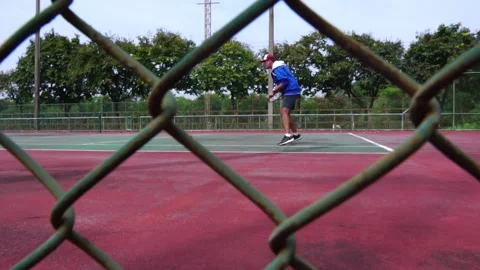 Man bouncing ball before serving on tennis court Stock Footage 206993587