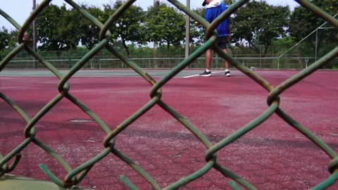 Man bouncing ball before serving on tennis court Stock Footage 206993616