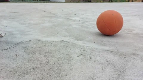 A man bouncing basketball ball training on ground floor Video stock 212238636