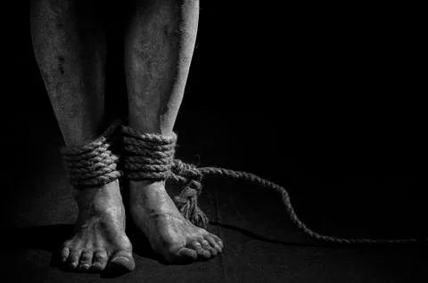 A man with bound legs. Stock Photos