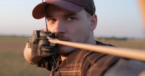 Man with bow Stock Footage 159479618