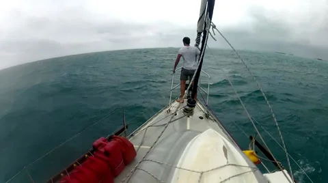 MAN IN THE BOW OF A YACHT Stock Footage 34219627