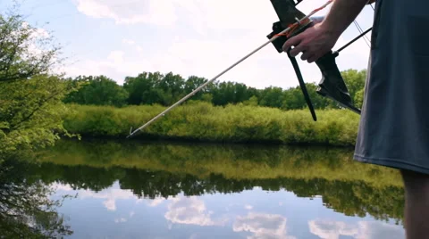 Man Bowfishing on Lake Stock Footage 50586312