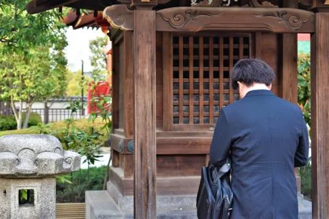 A man bows in prayer Stock Photos