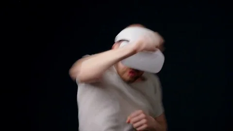 Man boxer in virtual reality glasses  fights with shadow Stock Footage 75178100