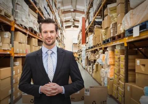 Man with boxes in warehouse Fotos de archivo