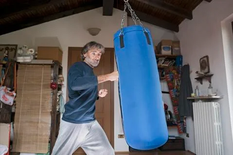 Man boxing bag Stock Photos