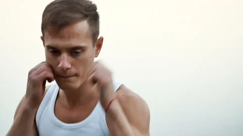 Man Boxing at the camera Stock Footage 98552943