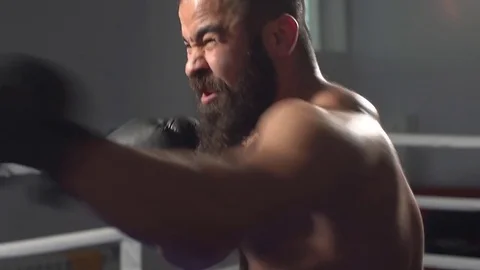 Man in boxing gloves in boxing training. slow motion Stock Footage