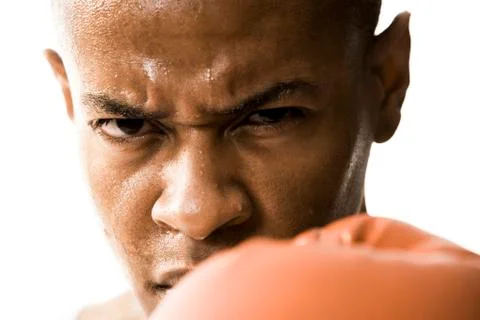 Man in boxing gloves sweating 库存照片