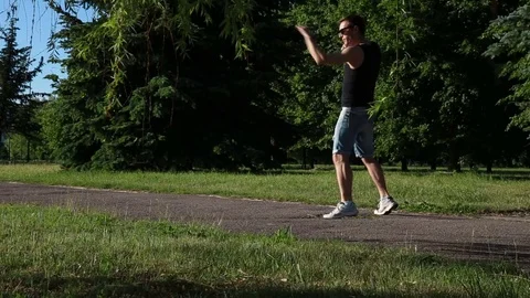 The man is boxing on the path Stock Footage 76819859